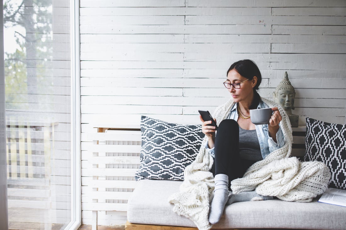 a woman sitting on a bed