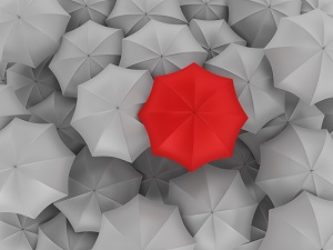 gray umbrellas with one red umbrella